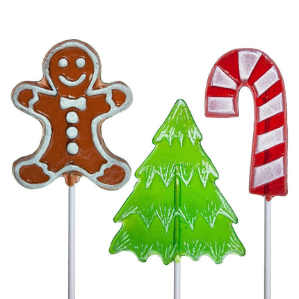 Three Christmas-themed lollipops on sticks: gingerbread man, Christmas tree, and candy cane.